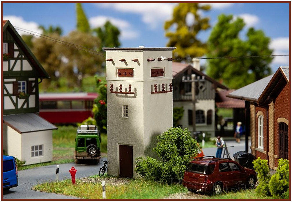Light-grey rendered substation tower with square b